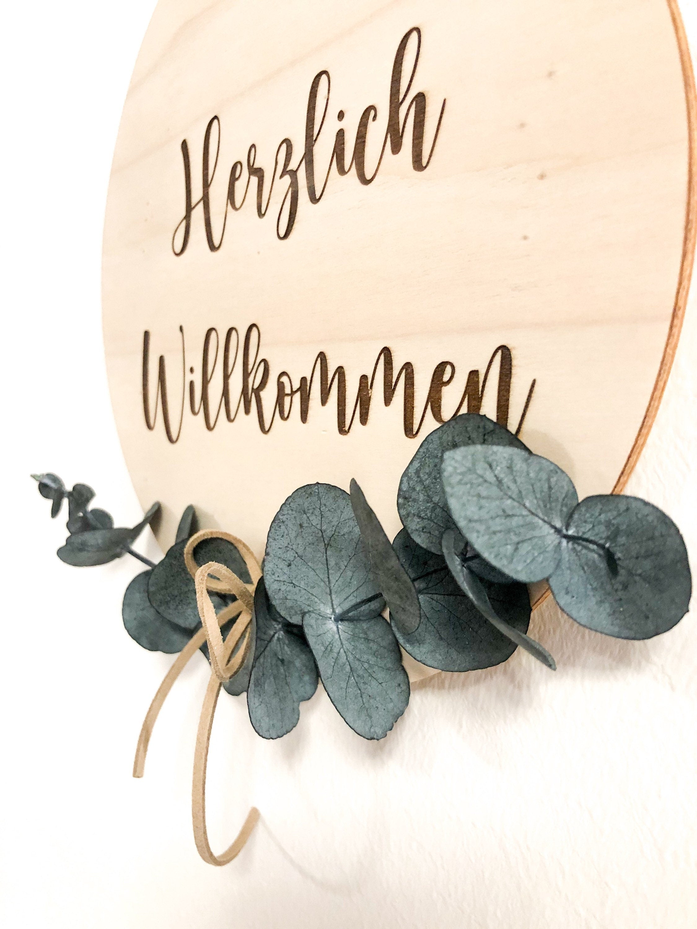 Wooden sign Welcome with eucalyptus